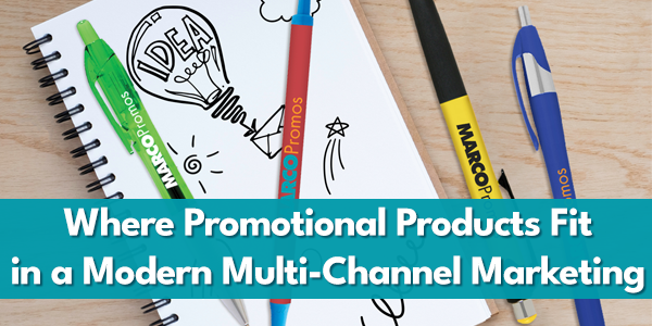 Colorful promotional pens with the MARCO Promos logo placed on a notebook with hand-drawn doodles.