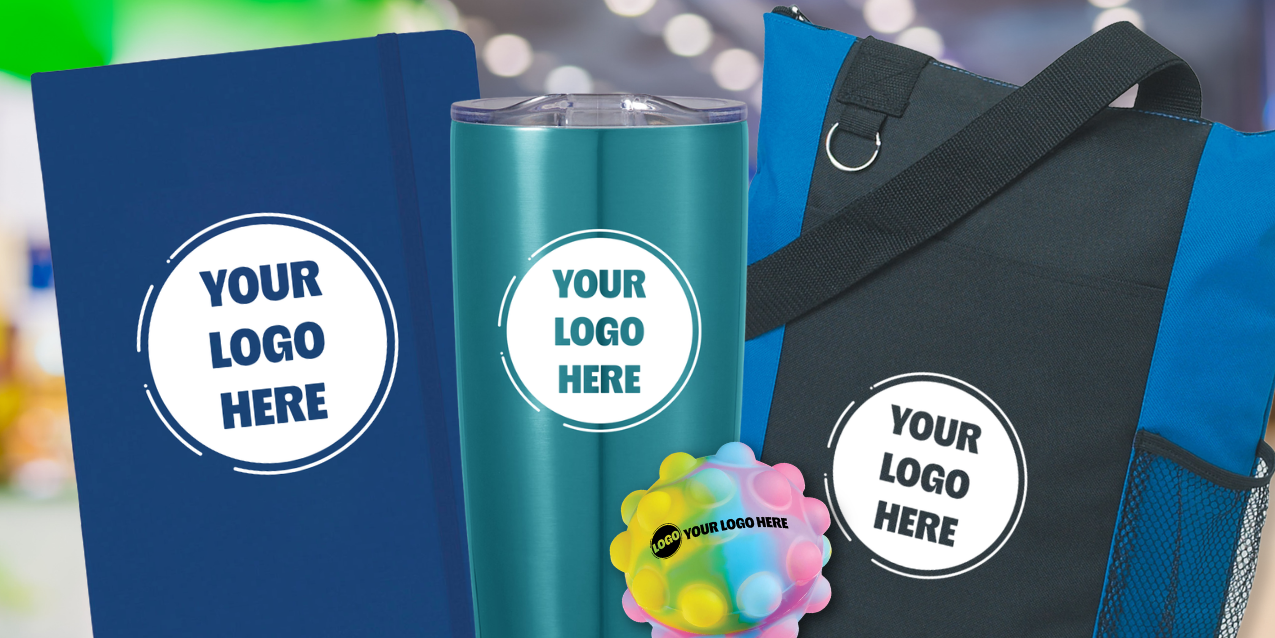 A collection of tradeshow giveaways including a totebag, notebook, tumbler, and stress ball.