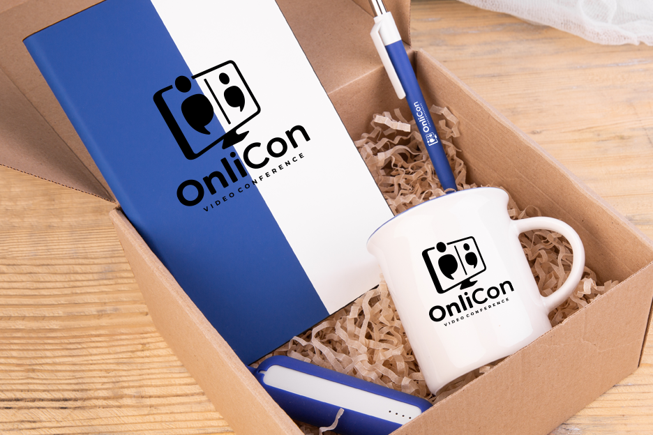 Shipping box filled with a notebook, mug, pen, and other promotional products.