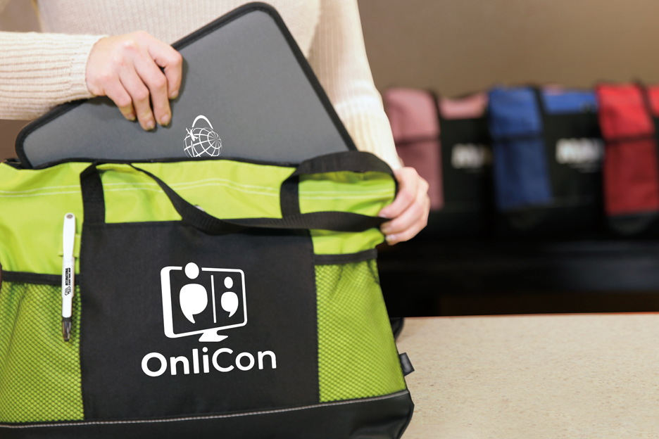 Attendee filling their trade show tote bag with more swag.