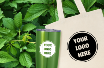 An eco canvas tote and tumbler in front of bright green leaves.