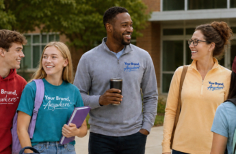 Group of people socializing outdoors on a campus.